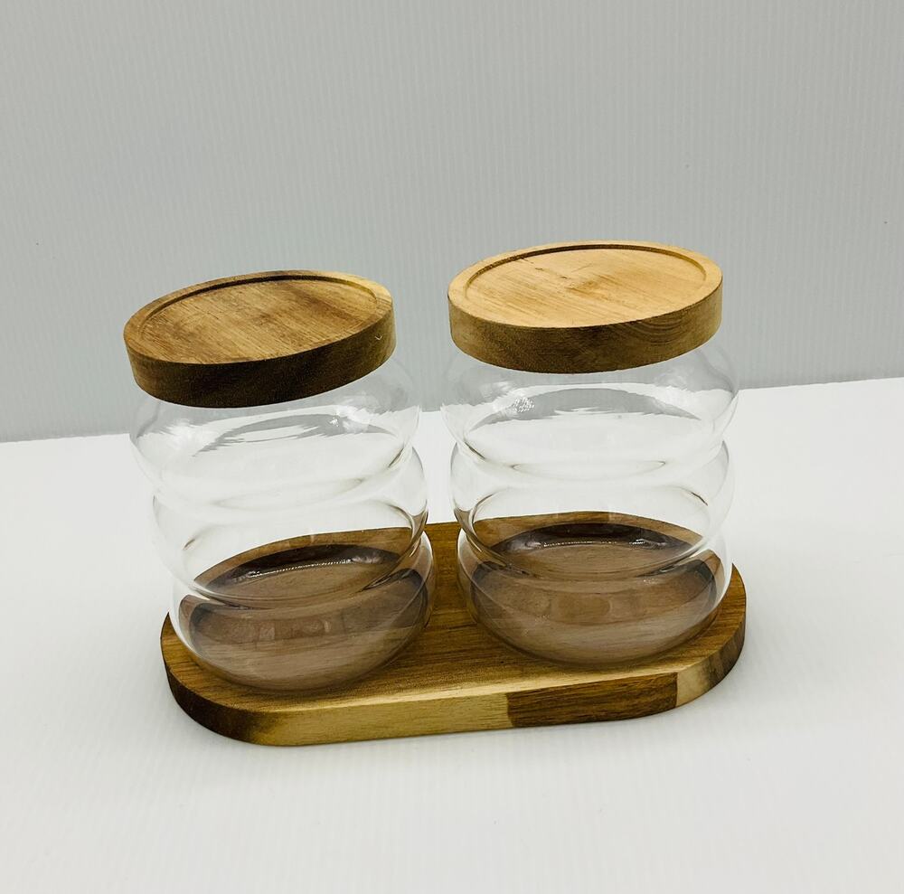 5-piece glass canister set with an acacia wood tray and lids